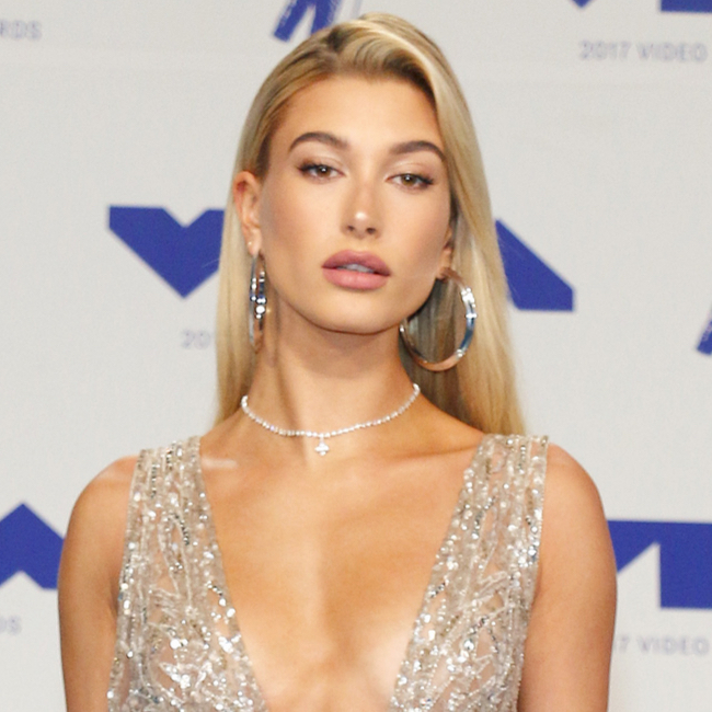 Hailey Bieber flashes her impressive abs for new Miu Miu ads