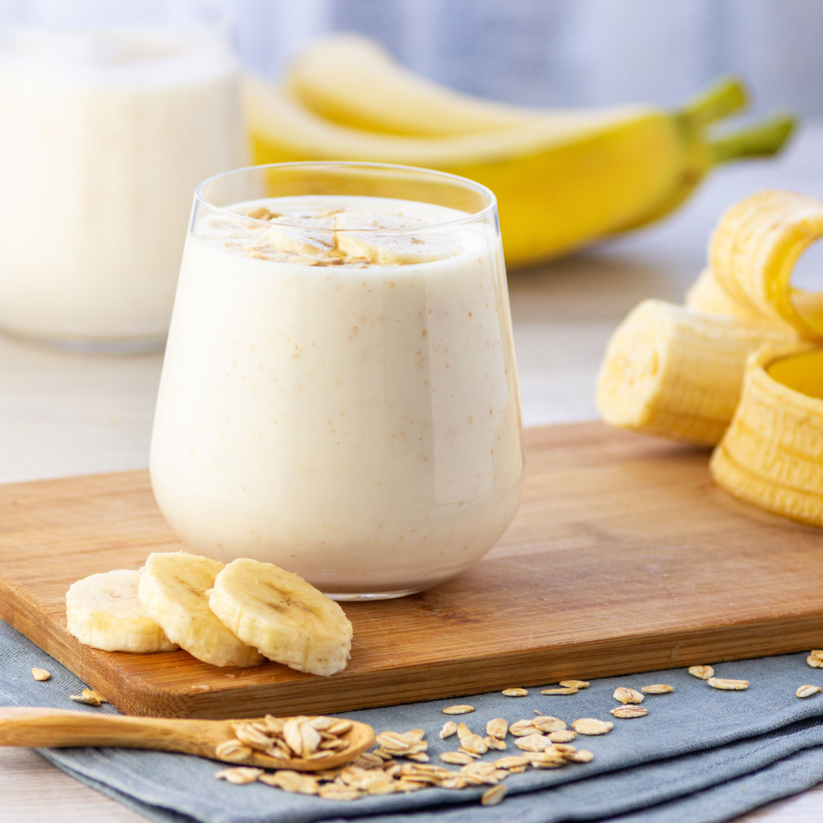 banana smoothie isolated glass wooden board