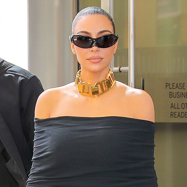 Kim Kardashian shows off her shrinking frame but hides her face with Yeezy  glasses after getting skin treatment