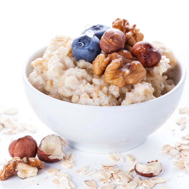 oatmeal brown sugar blueberries walnuts white bowl table