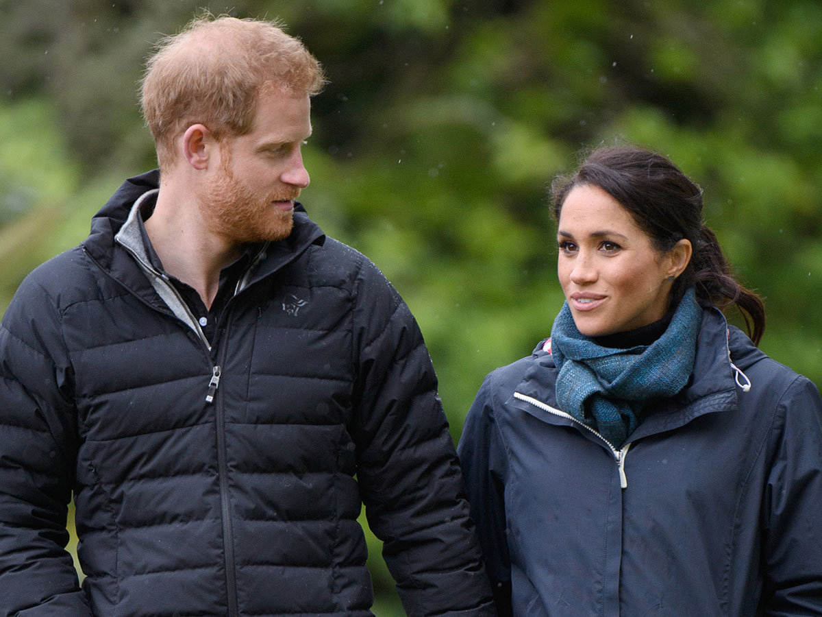 prince harry walking beside meghan markle