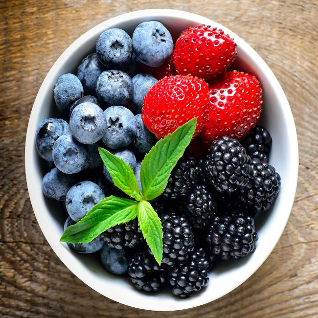 blueberries, blackberries, and strawberries in a bowl