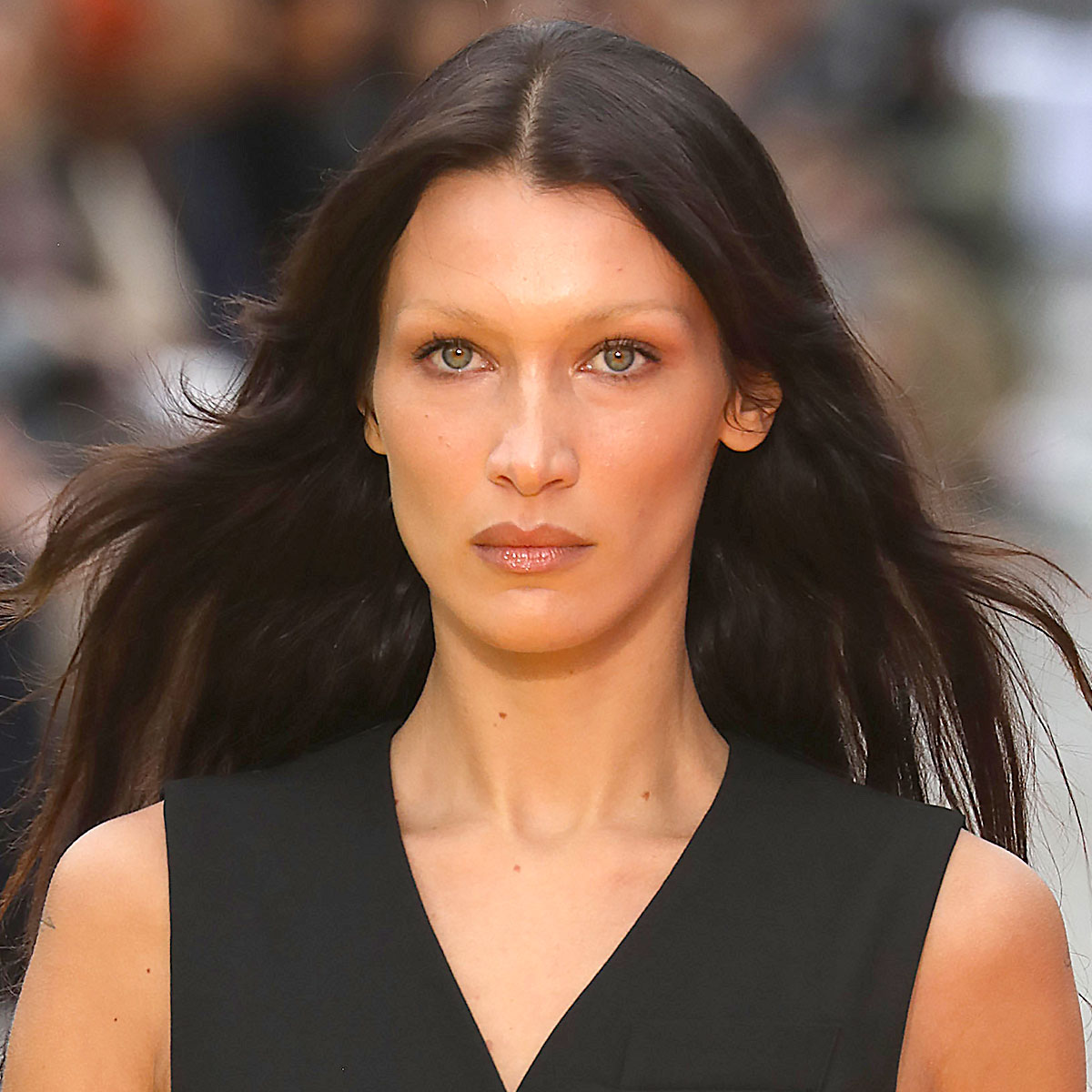 Bella Hadid cuts fashionable figure in sheer black top and knee-length  trousers as she buys balloons
