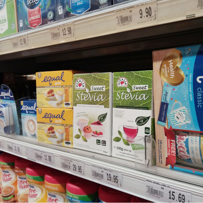 artificial sweeteners on shelves in grocery store