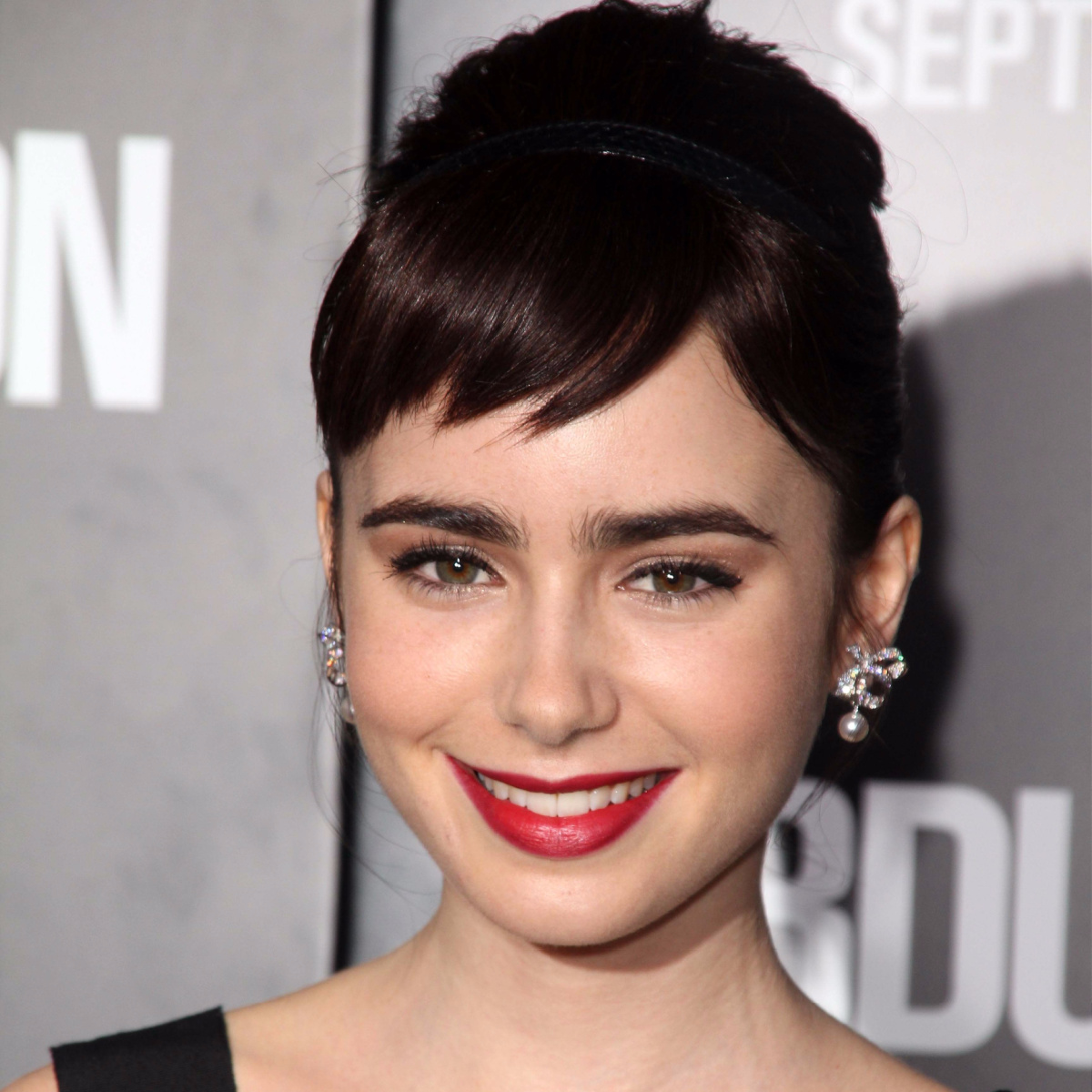 lily collins brown hair updo baby micro bangs abduction red carpet premiere 2011