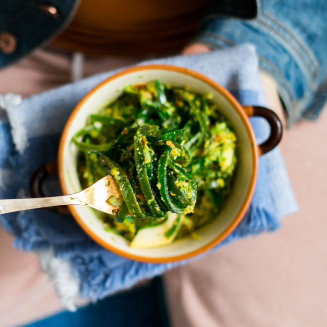 woman eating bowl of seaweed