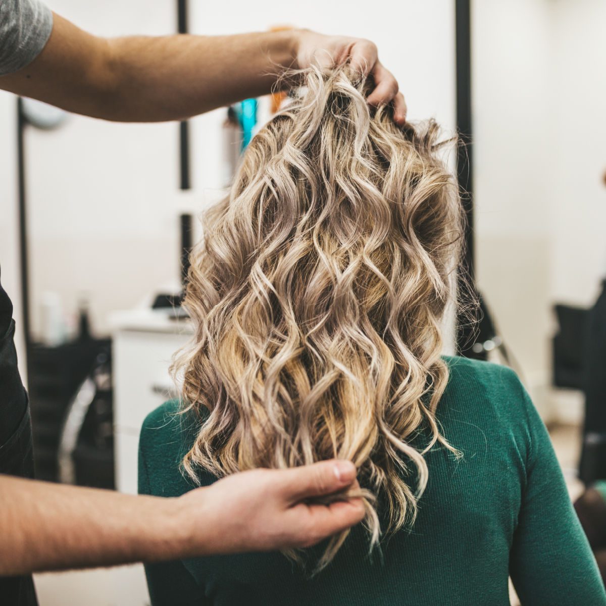 Woman with blonde hair in a salon.