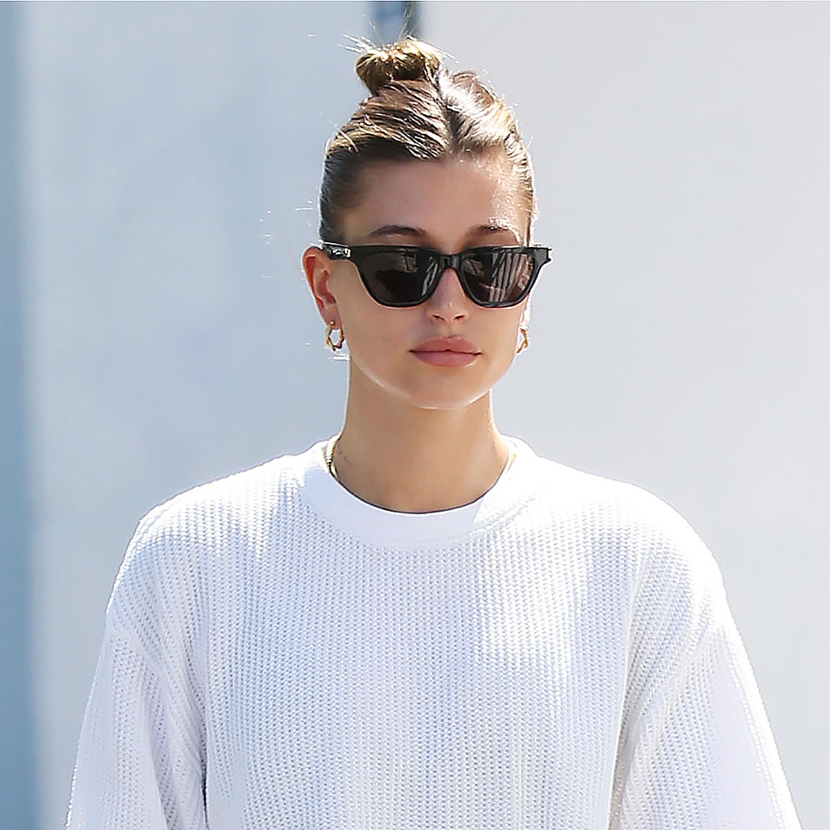 Hailey Bieber flaunts her street style in leggings and crewneck sweater