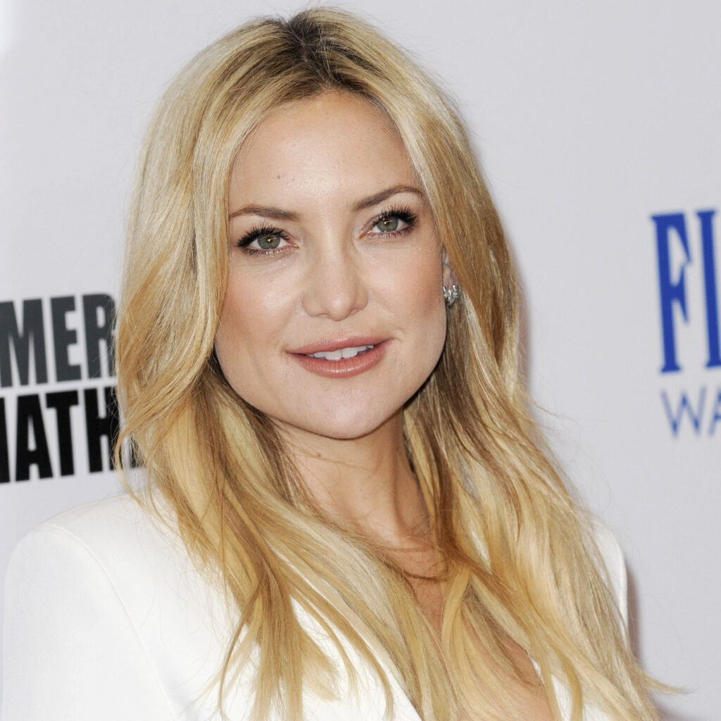 Kate Hudson shows off her sculpted physique in plunging black top