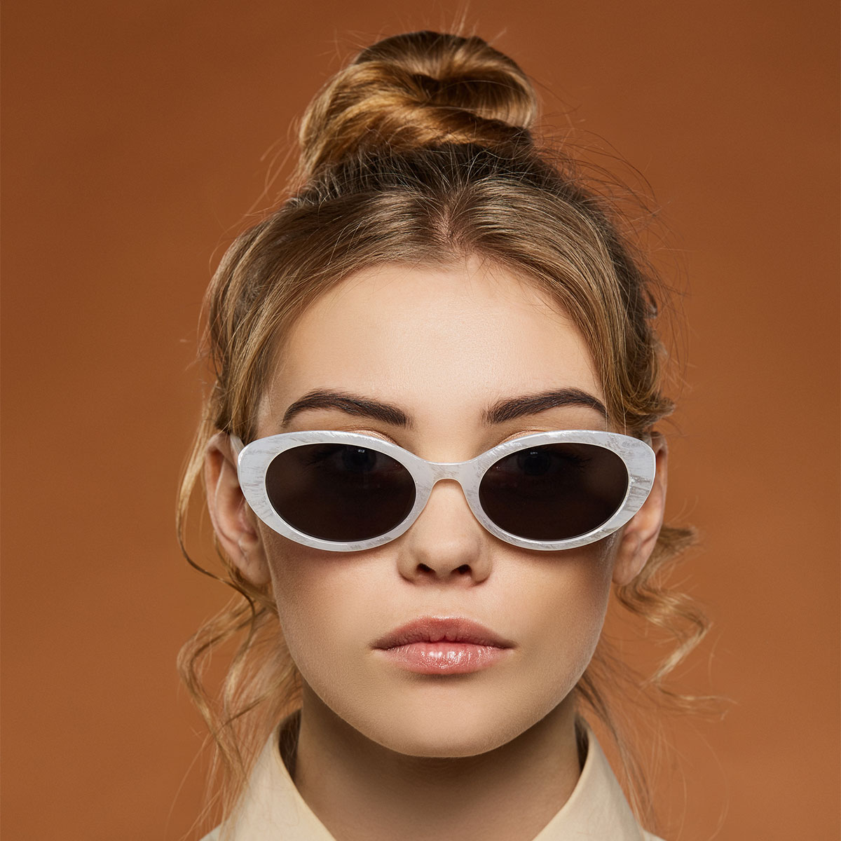 woman-wearing-hair-bun-sunglasses