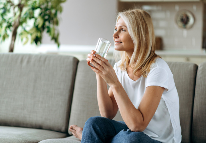 Woman drinking water.