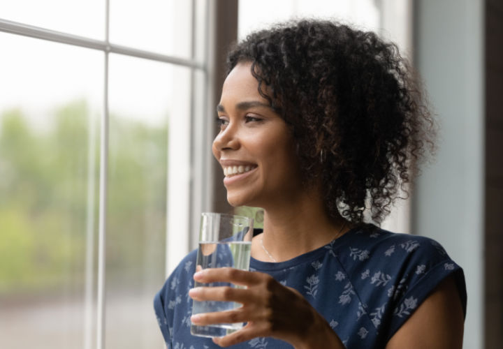 Woman drinking water.