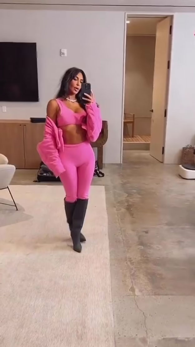 Kim Kardashian bares abs in Valentine's Day pink at Skims pop-up