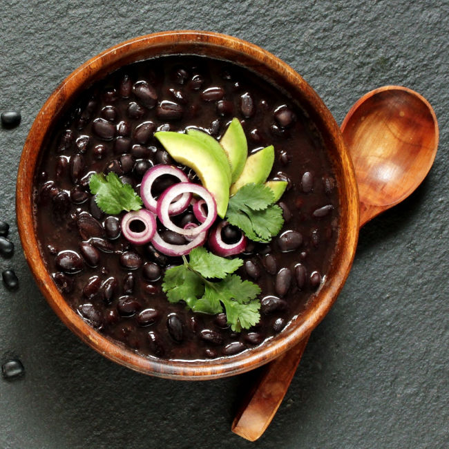 black beans in wooden bowl