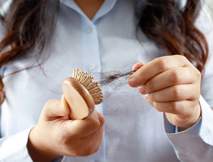 Hair fallout in hairbrush.