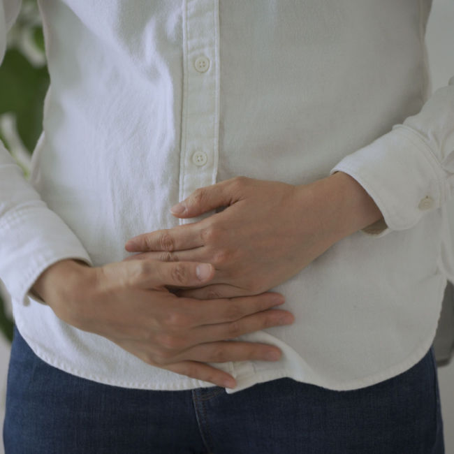 person holding stomach