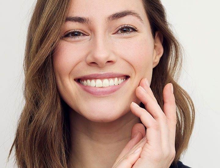 Woman smiling.