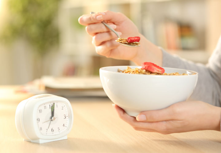 Woman eating yogurt.