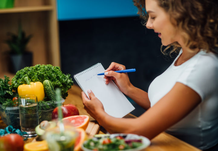 Woman planning out meals.