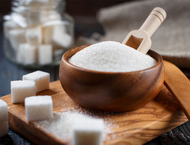 Bowl of white refined sugar