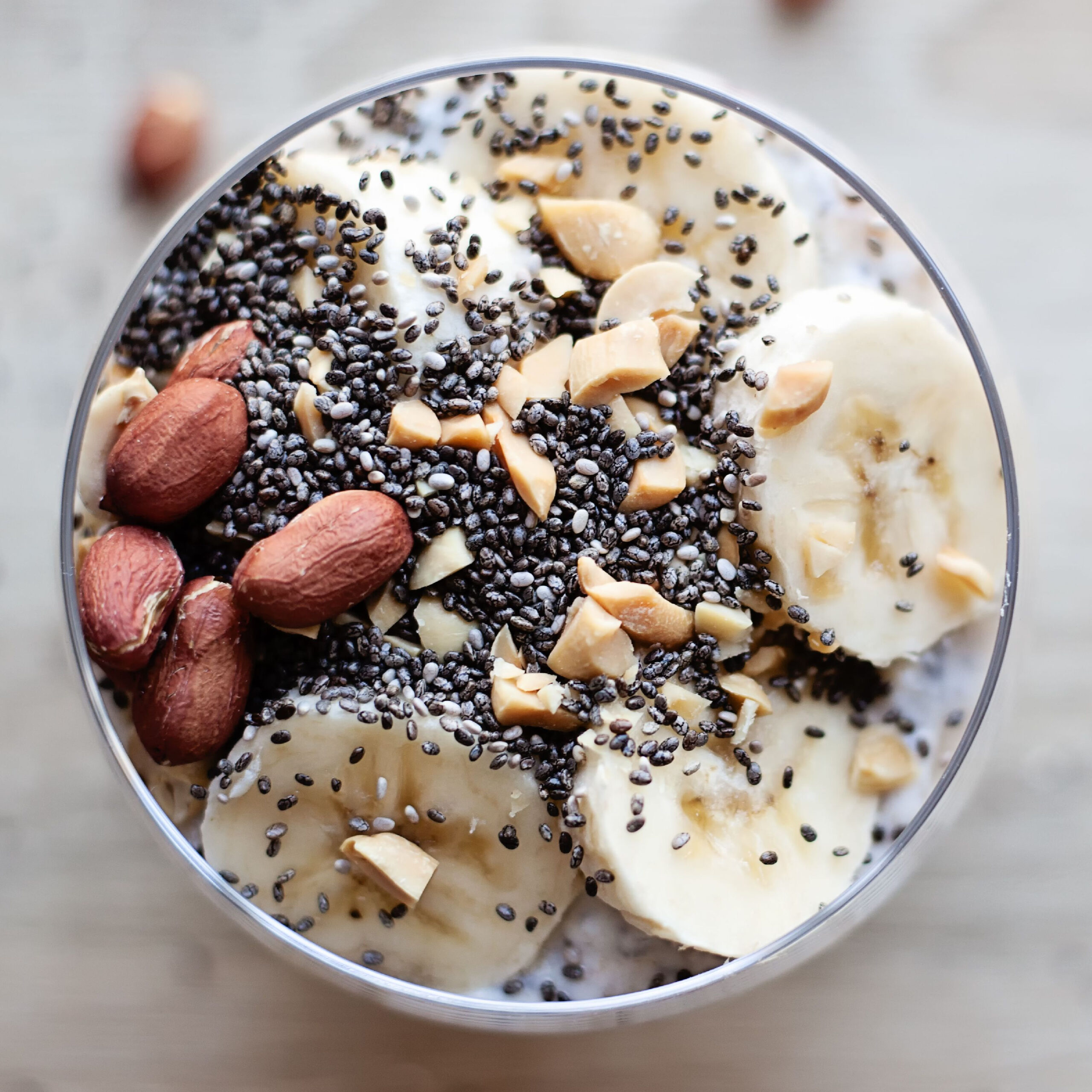 chia seed putting topped with nuts and bananas