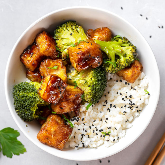 rice bowl topped with tofu and broccoli