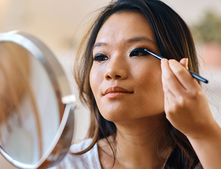 https://www.shefinds.com/files/2023/03/woman-applying-eyeshadow-in-mirror.jpg