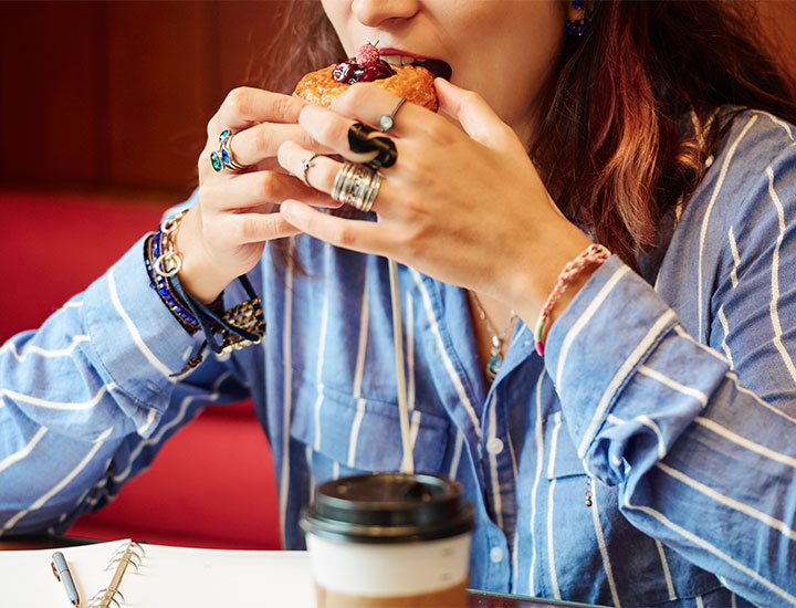 Woman eating a pastry