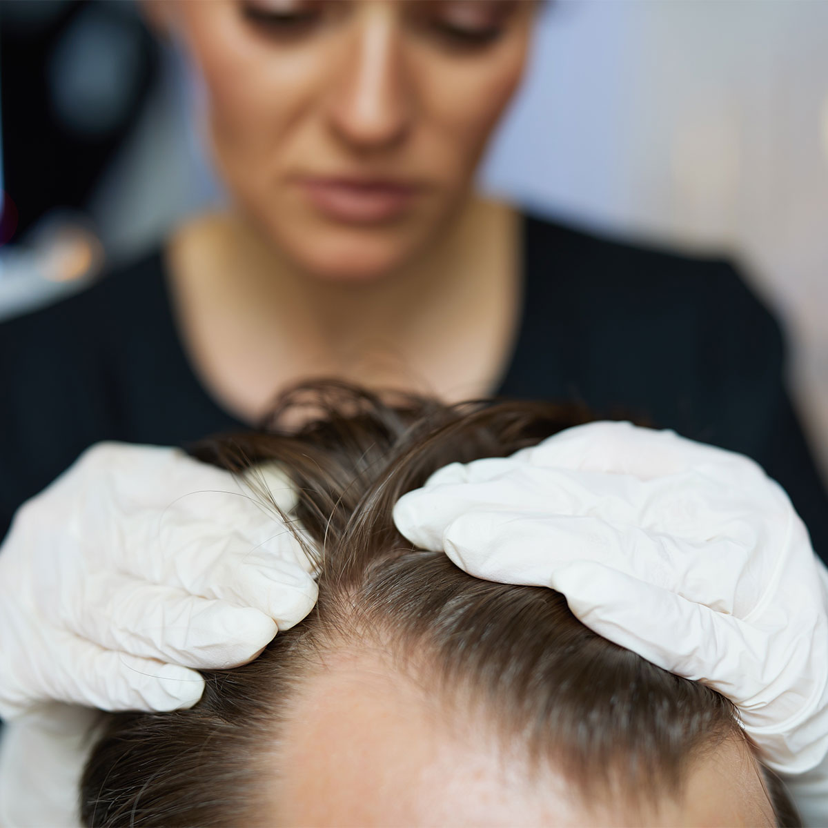 woman-getting-hair-checked