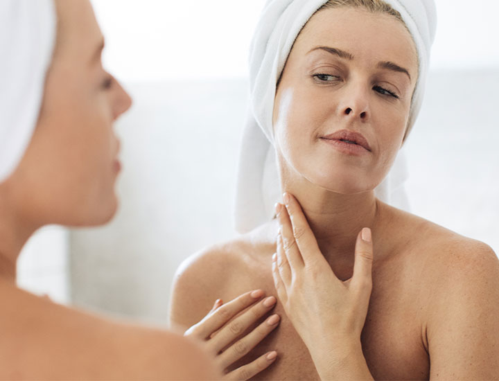 woman-looking-at-neck-mirror