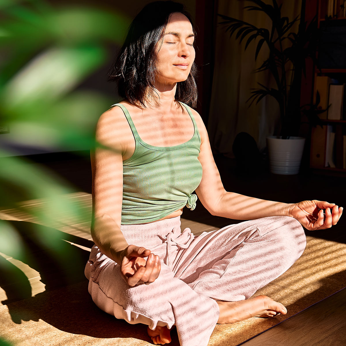 woman meditating on floor