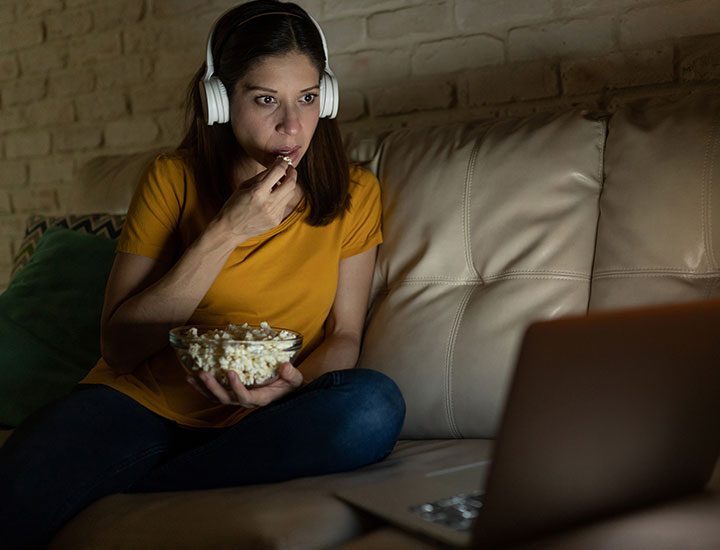 Woman snacking.