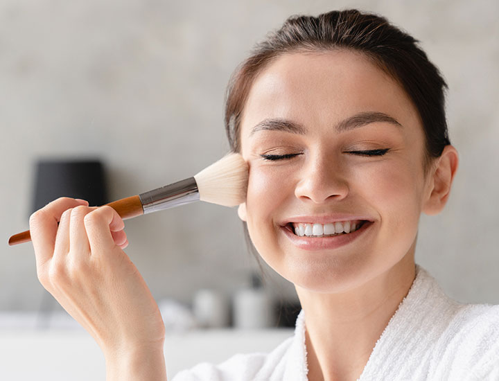 woman-using-makeup-brush