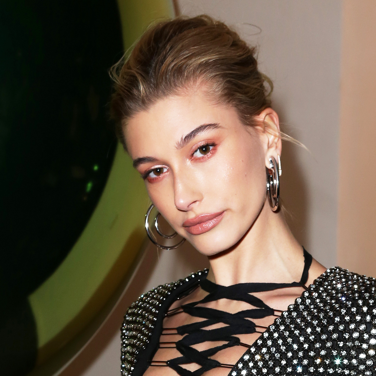 Hailey Bieber does no trousers trend in a micro shorts bodysuit