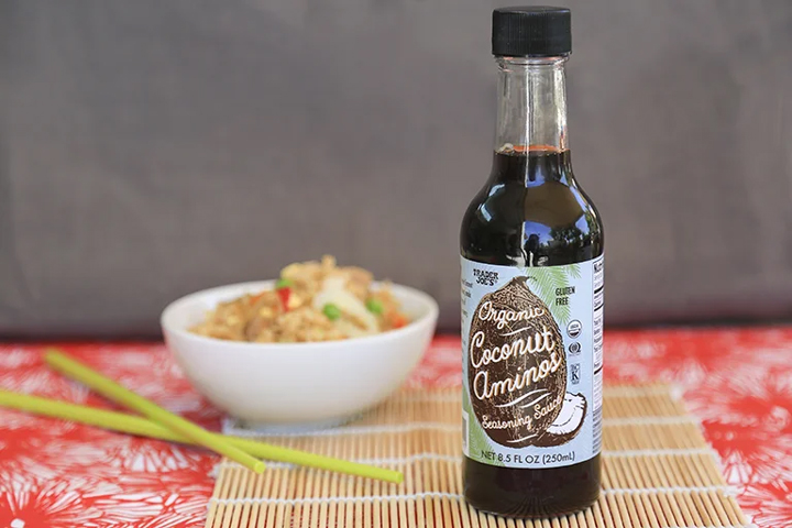 Trader Joe's Coconut Aminos sits on table