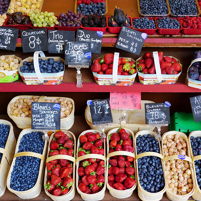 various berries on display at market