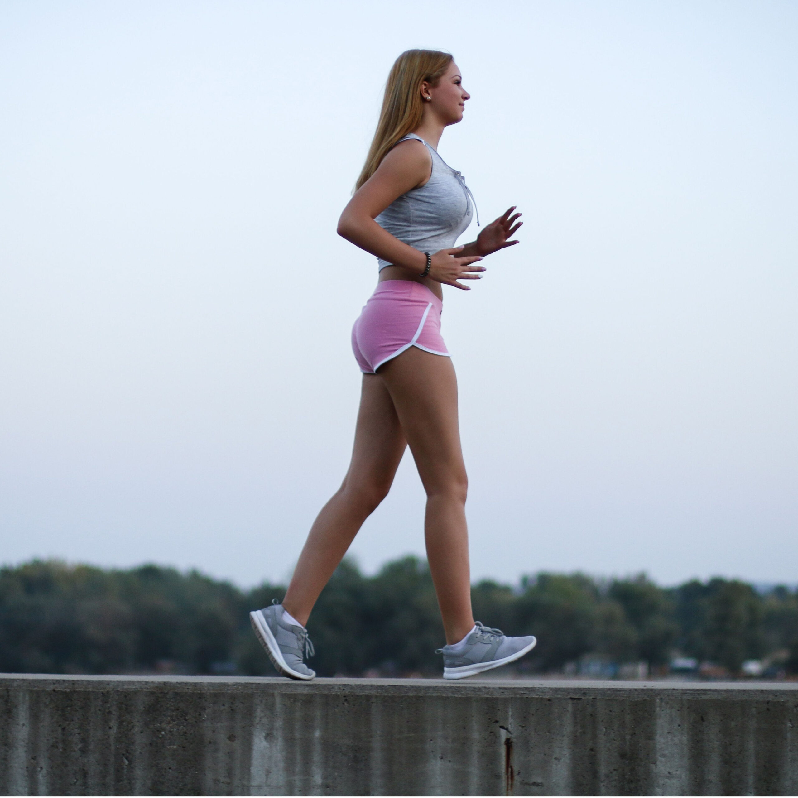 woman taking brisk walk outside