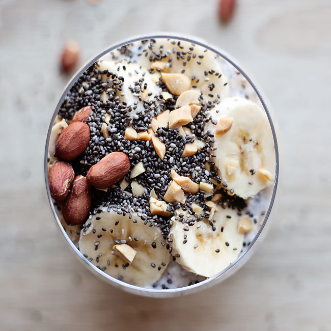 breakfast bowl topped with chia seeds and slices of banana