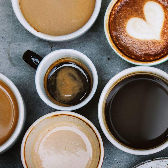 various cups of coffee of different sizes and colors