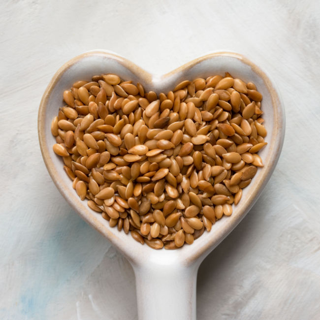 flaxseeds in heart-shaped spoon