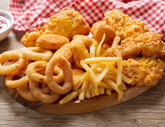 basket of fries, onion rings, and chicken nuggets