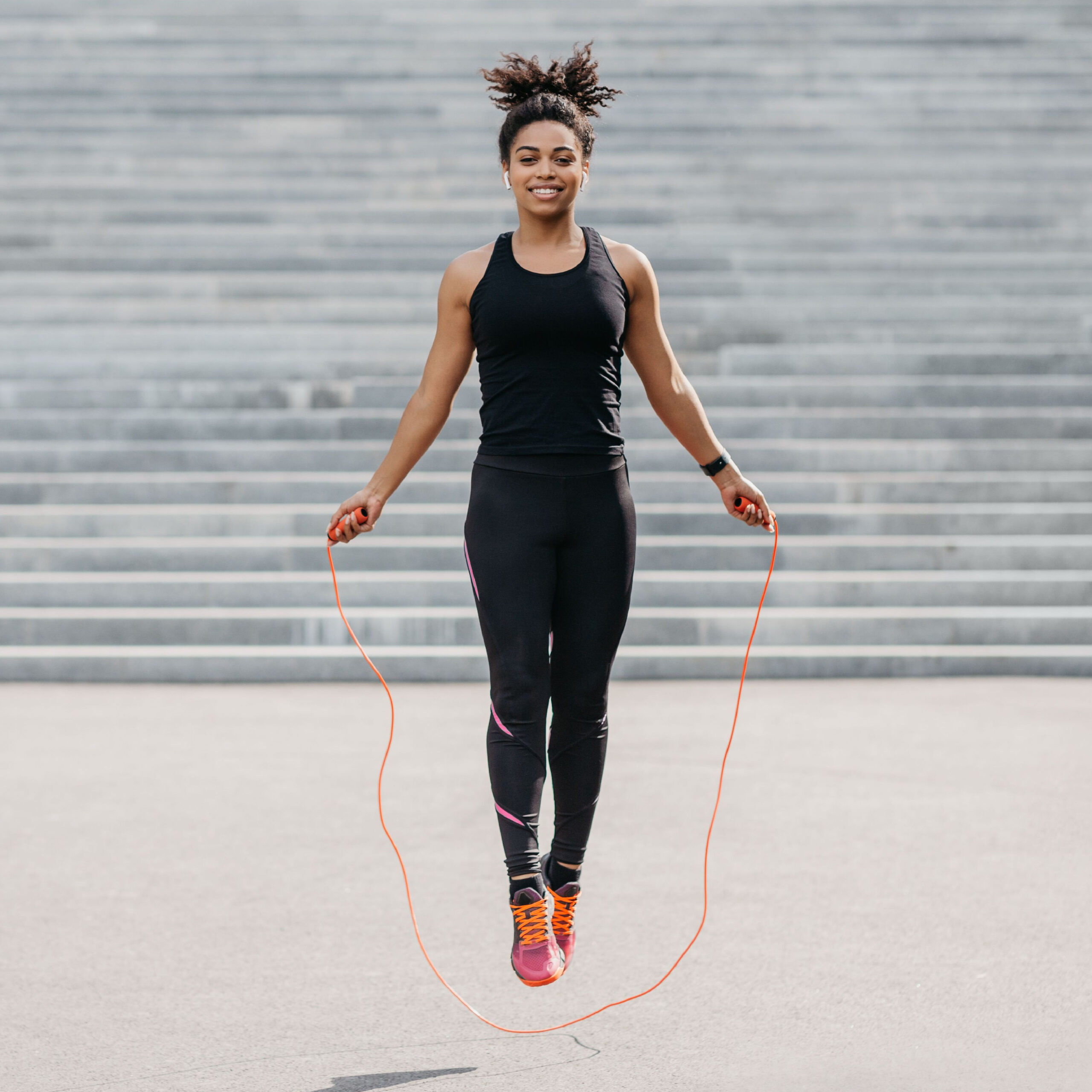 woman jump-roping outside