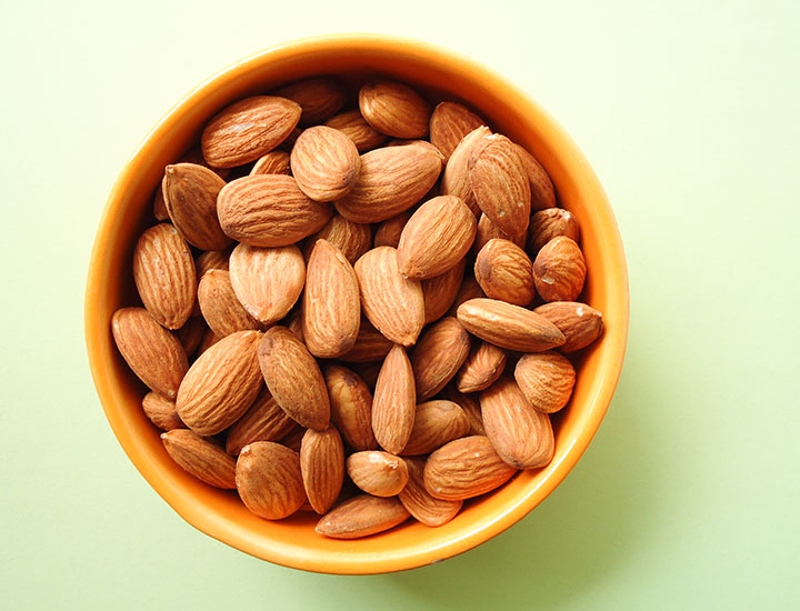 Orange bowl of almonds