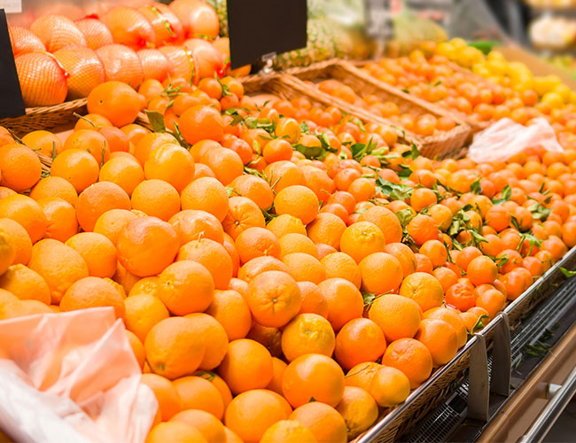 oranges on display at outdoor market