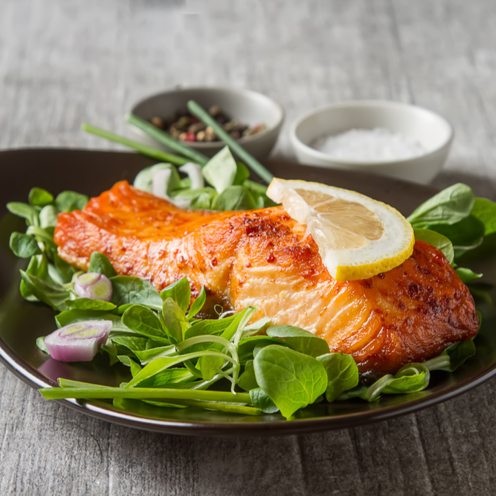 salmon on plate with greens