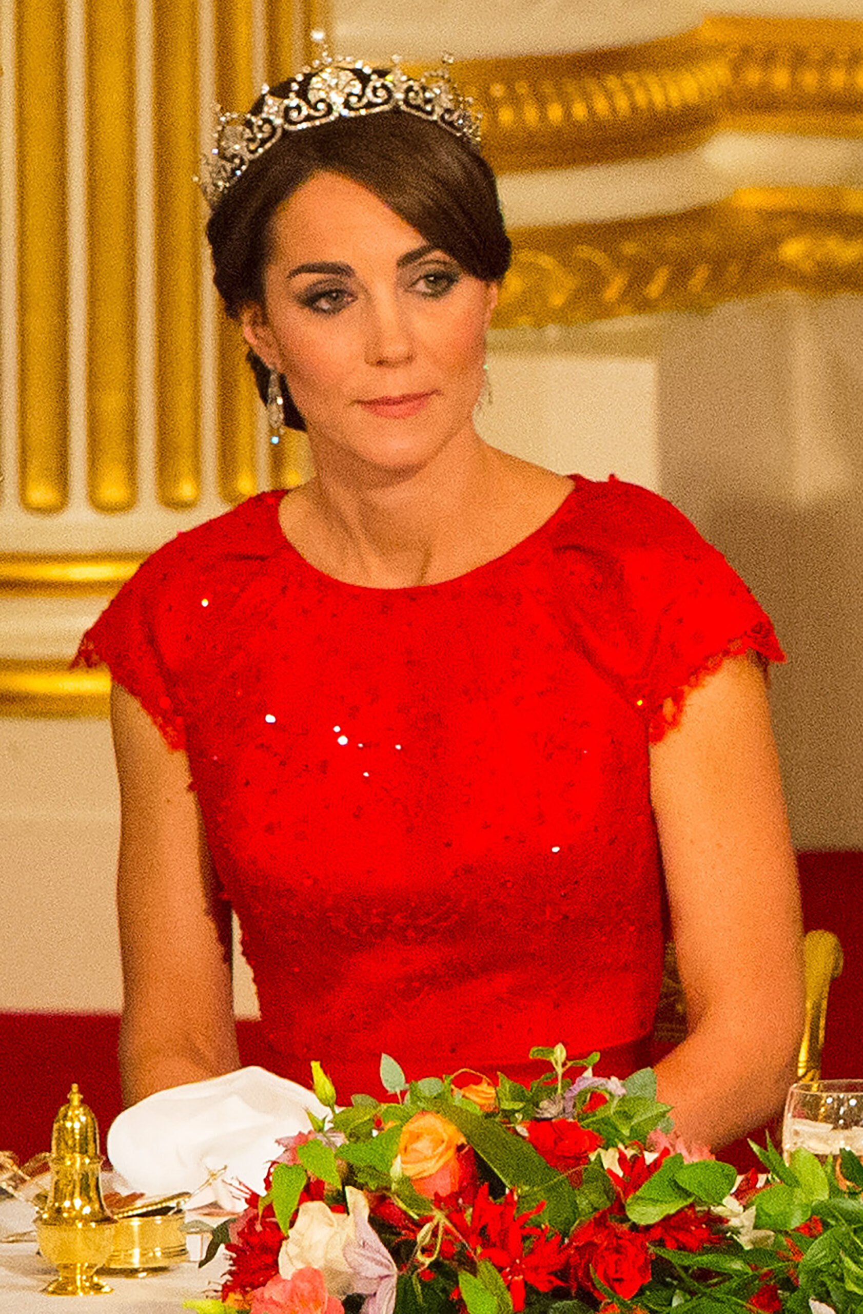 Kate Middleton wearing a red dress and tiara for a dinner in China