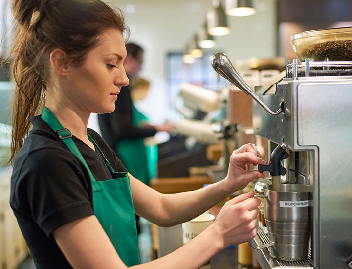 Starbucks barista making coffee drink