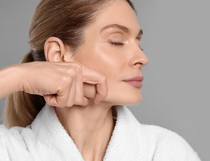 Woman doing facial massage