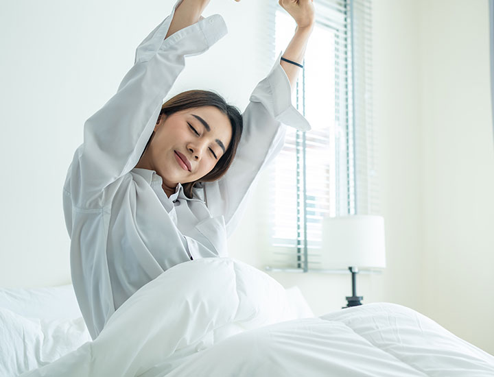 Woman waking up well rested