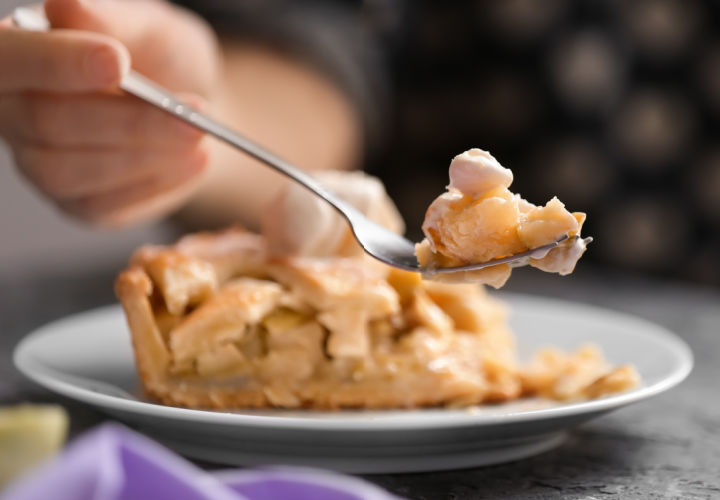 Woman eating apple pie